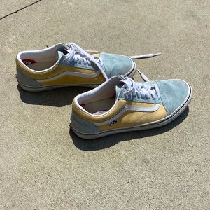 Pro cushion skate boarding mustard and teal vans.